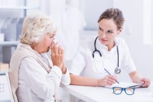 woman with allergies talking to doctor